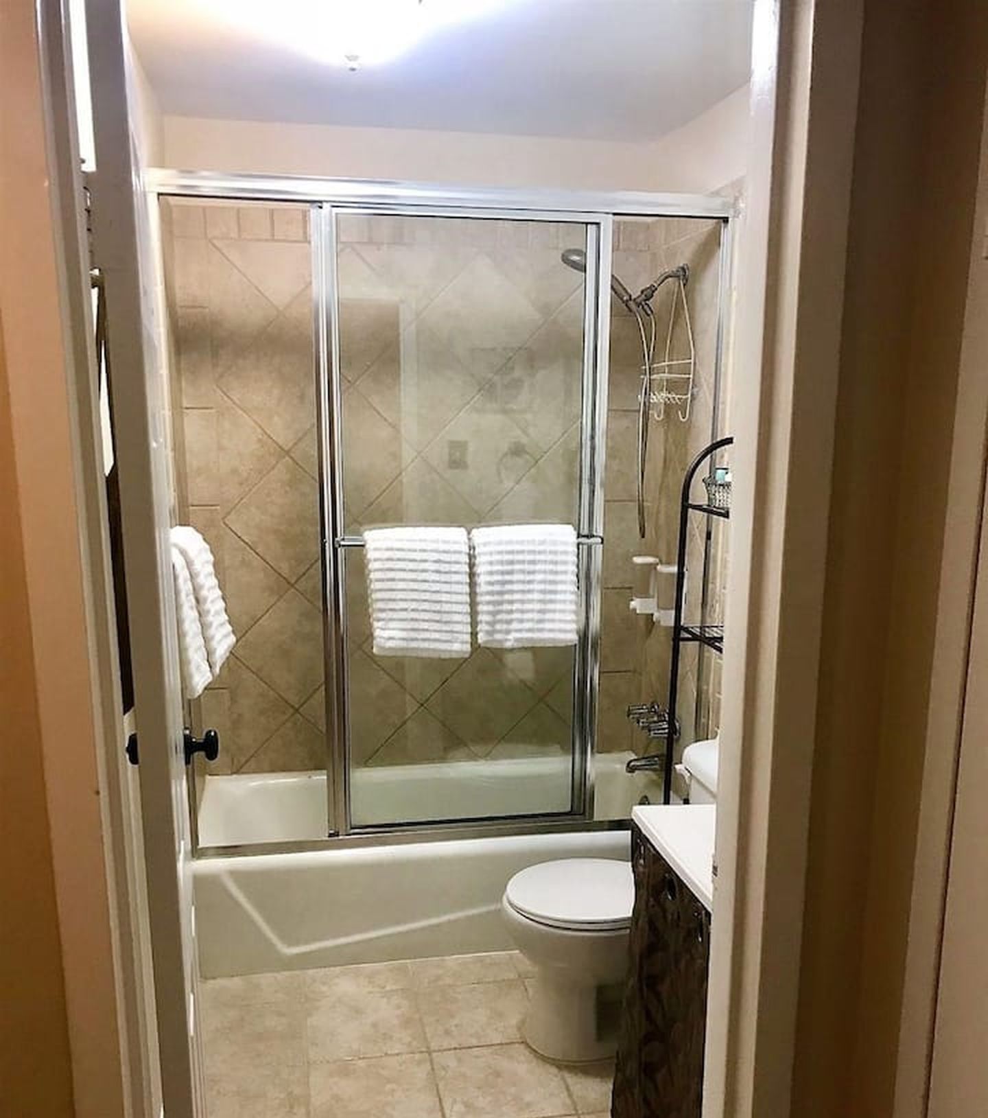 Combined shower/tub, hair dryer, towels, soap