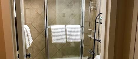 Combined shower/tub, hair dryer, towels, soap