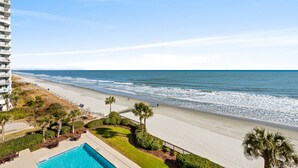 A beachfront hotel with a swimming pool, beach access, and ocean views. - ~ Serenity by the Sea ~ Luxury 2 bedroom Condo, Washer & Dryer! (Myrtle Beach)