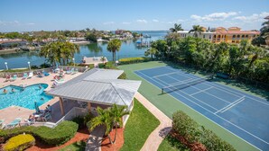 A resort with a swimming pool, tennis courts, and a marina. - Gorgeous Bay Views | Shore Retreat (St. Pete Beach)