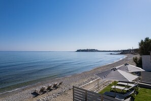 On the beach, sun loungers, beach towels