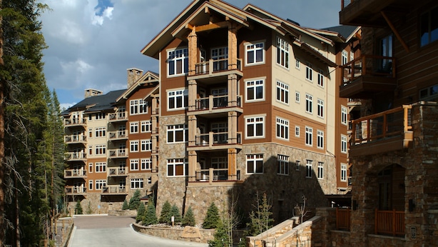 A multi-story hotel with balconies, stone facade, and a central courtyard. - Luxurious 2 Br In River Run Village With Ski In Ski Out, No Cleaning Fees, Kids Ski Free 2 Bedroom Condo by RedAwning (Keystone)