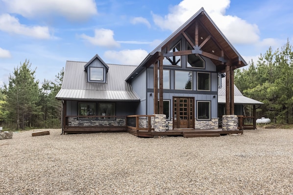 Relax on the large deck area or enjoy the spacious interior of this two-story home.