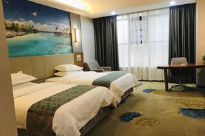 A hotel room with two beds, a desk, and a large window with curtains. - Wanhe Hotel (Hengyang County)