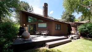 A modern house with a patio, outdoor furniture, and a chimney. - Hermosa Haven | Red Cliff Views, Garage, 30+ Stay (Durango)