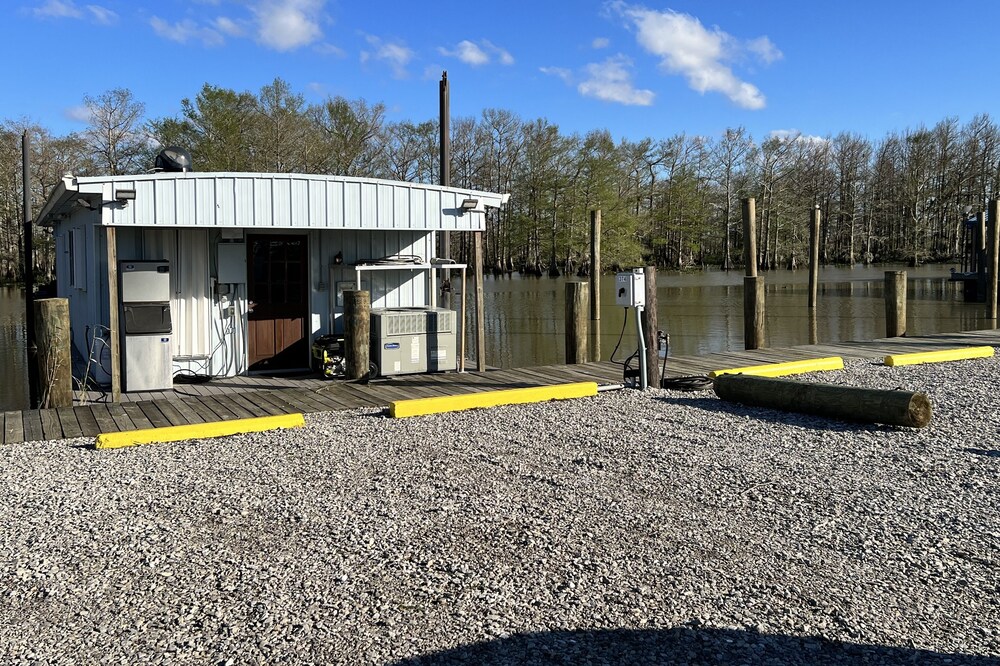 Drive up & park 6 ft from this clean, equipped houseboat in Cypress Cove Marina