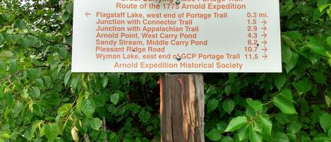 A signboard with trail information for the Great Carrying Place Portage Trail.
