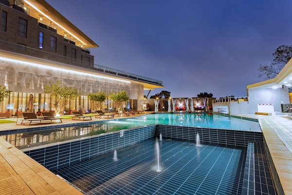 Outdoor pool, open 6:00 AM to 6:00 PM, free pool cabanas, pool umbrellas