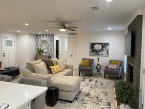 Smart TV, fireplace, books