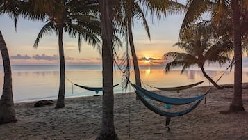 On the beach, sun-loungers, beach towels
