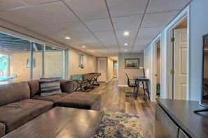 TV, fireplace - Twin Oaks Retreat by Chatuge Home Concierge | Lakefront w/ Pvt Covered Dock · Firepit · Ping Pong · Shuffleboard · Water Carpet (Hiawassee)