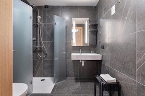 Shower, rainfall showerhead, bidet, towels