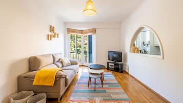 City Apartment | Living area | 40-inch flat-screen TV with cable channels, TV
