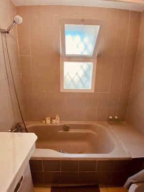 Bathtub, hair dryer, towels