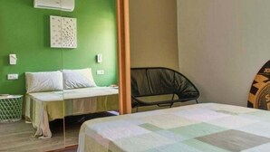 A room with a bed, a chair, a mirror, and a wall-mounted air conditioner. - Roses with sea views, Canyelles Brava beach, AV-10 (Rosas / Roses)