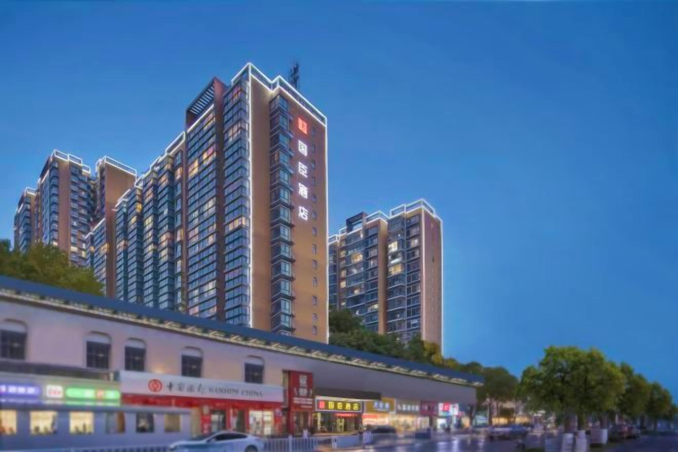 A multi-story residential building with a commercial ground floor.