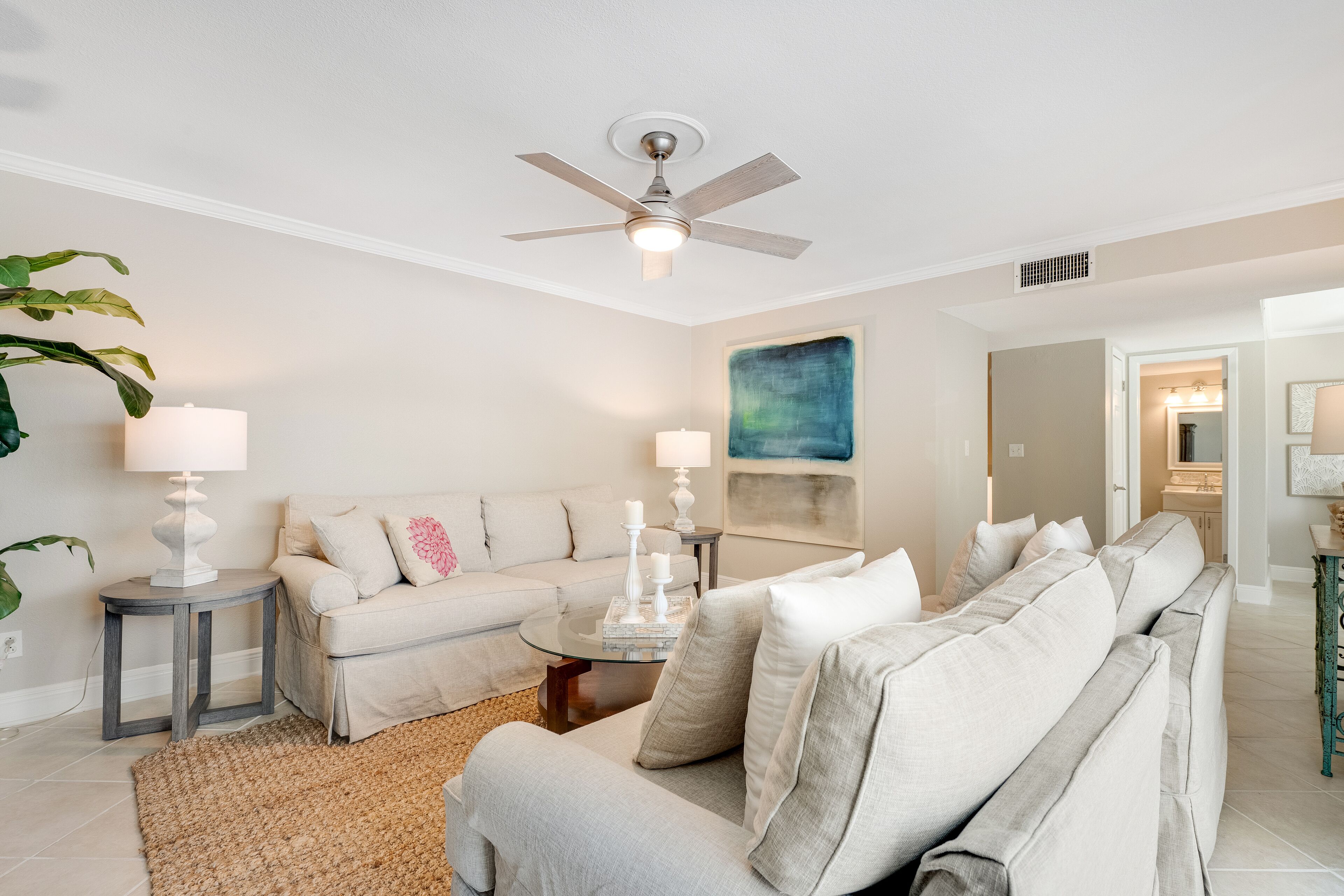 Bright & beachy getaway with beach access, shared pool, furnished deck, & WiFi