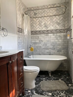 Combined shower/tub, hair dryer, towels, soap