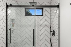 Shower, hair dryer, towels, soap