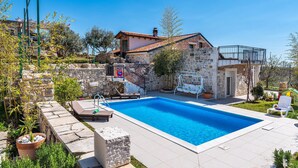 A stone house with a swimming pool, a small garden, and a balcony. - Amazing home in Razanac (Razanac)