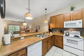 Microwave, oven, stovetop, dishwasher - Cheerful 2 bedroom Condo close to Disney w/pool and Spa. (Davenport)