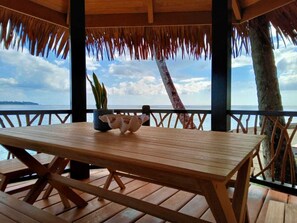 Relax on the shaded deck with a view of the water and shoreline.