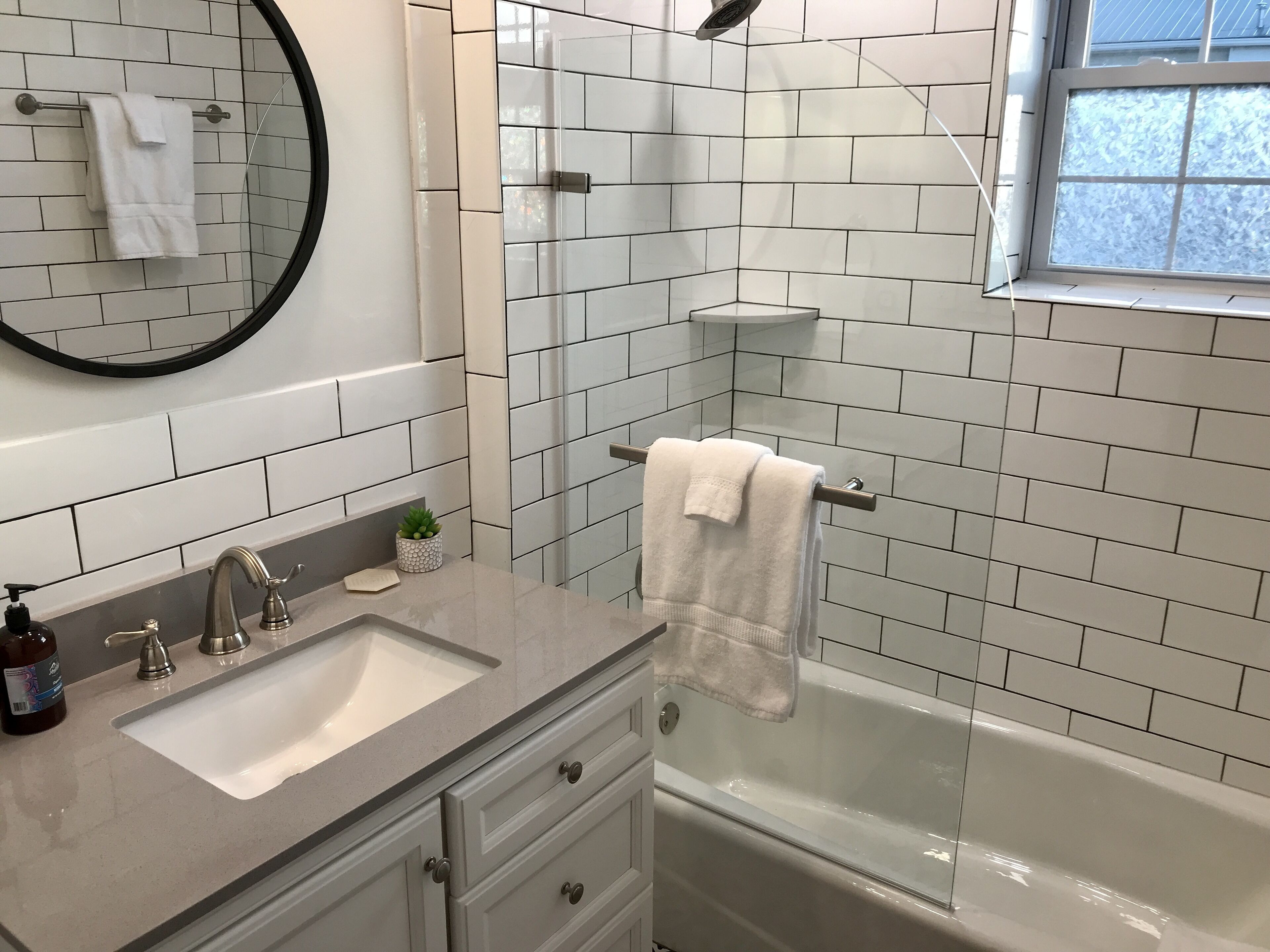 Bathtub, hair dryer, towels, soap