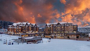A large lodge with multiple floors and a ski lift in the foreground. - SPRING BREAK - SLOPESIDE Luxury Ski-in/Ski-out- Grand Colorado Peak 8 - SLEEPS 4 (Breckenridge)