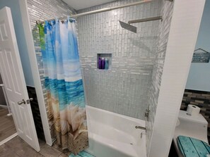Bathtub, hair dryer, towels, soap