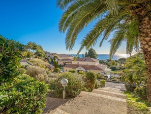 Enjoy ocean views from this two-story house with a garden and a chimney.