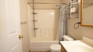 A bathroom with a shower, toilet, and sink. - Cozy 3 Bedroom Private Pueblo West Duplex Close To Lake (Pueblo)