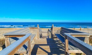 A wooden boardwalk leading to the beach with a clear view of the ocean. - 🦀 Knot Too Crabby - 5 BR home w/Private Pool & Hot Tub 🦀 (Southern Shores)