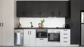 Apartment | Private kitchen | Full-sized fridge, microwave, oven, stovetop