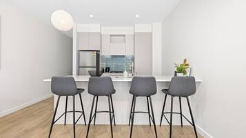 Three Bedroom Townhouse With Parking | Private kitchen | Full-size fridge, microwave, oven, stovetop