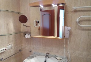 Bathtub, hair dryer, towels