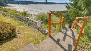 A wooden staircase leading down to a beach with a sign indicating a picnic area. - Waterfront PNW Escape w/ Deck & Beach Access! (Port Hadlock-Irondale)