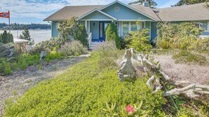 A house with a blue exterior, a front porch, and a view of a body of water. - Waterfront PNW Escape w/ Deck & Beach Access! (Port Hadlock-Irondale)