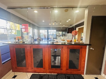 Check-in/check-out kiosk at Casa Blanca Hotel - Orange