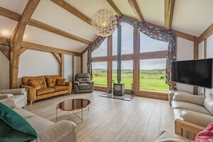 Casa de campo | Zona de estar | Una chimenea