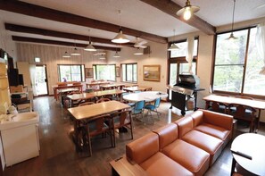 Enjoy meals in this dining area with a variety of seating options and a grill station for outdoor cooking.