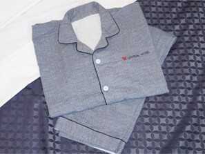 A neatly folded grey shirt with a collar and buttons, and a small logo on the left chest area. - Standard Room only Single B Nonsmoking / Taito-ku Tokyo (Taito-ku)