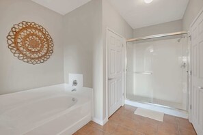 Bathtub, hair dryer, towels, soap
