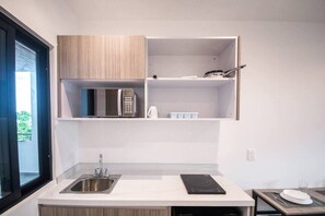Fridge, microwave, stovetop, coffee/tea maker