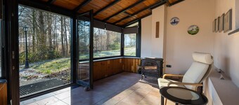 House in the forest with fenced garden
