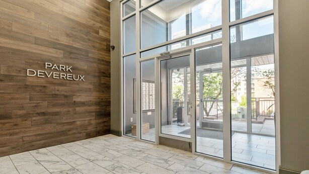 A modern interior with a wooden wall and a sign reading "PARK DEVEREUX". - One Bedroom Hideaway w/ free parking steps to Downtown (Raleigh)