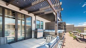 A modern outdoor patio with a grill, seating, and a pergola. - O-50&51 | 2 Homes! Pvt Heated Pool &  Pvt Hot Tubs (Santa Clara)