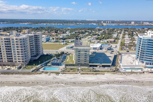 Oceanfront - the unit has a door leading out to the grassy area in the photo