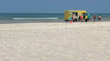 On the beach, sun-loungers