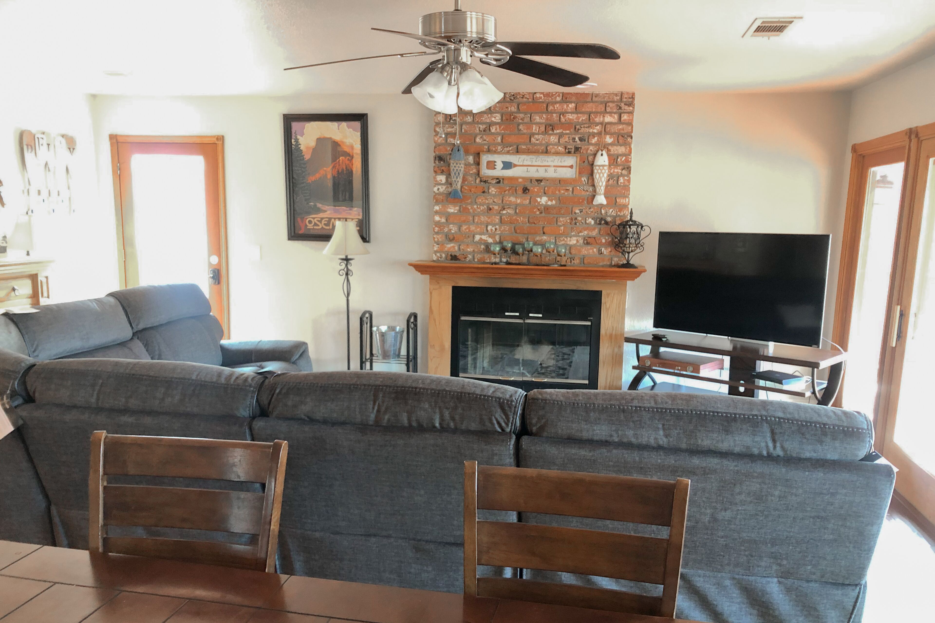 Dog-friendly lake-view home with boat slip, lovely deck, wood fireplace & games