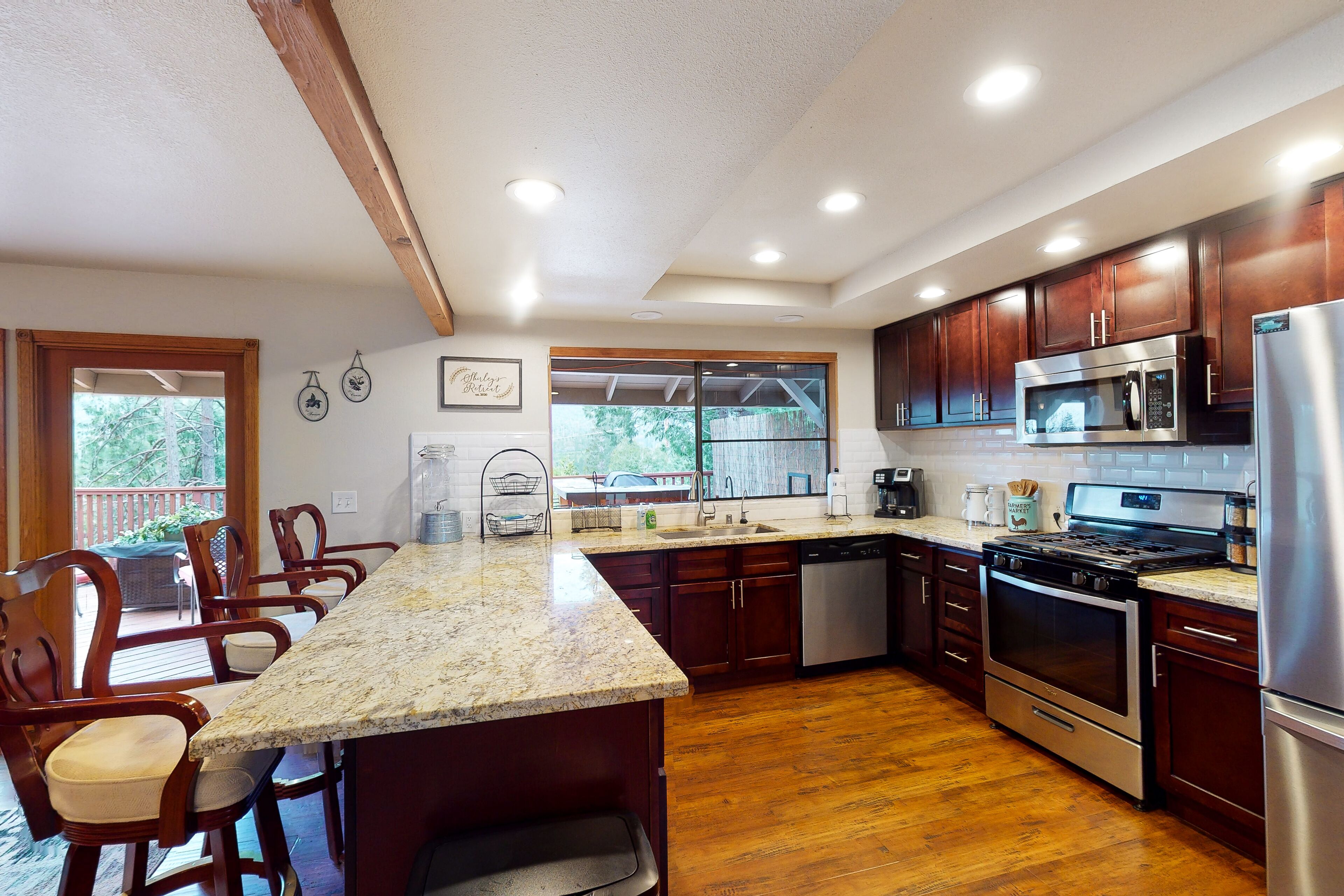 Dog-friendly lake-view home with boat slip, lovely deck, wood fireplace & games